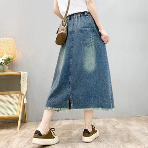 Chân váy denim lưng thun một túi lớn thêu hoa lá - V009