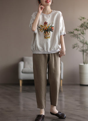 Áo T-shirt ngắn tay cổ tròn bo viền in bình hoa - NU7501